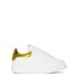 White oversized trainers with metallic yellow contrast detail