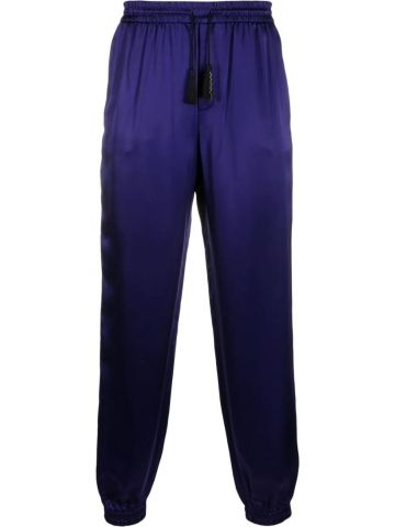 Pantaloni affusolati viola con nappe