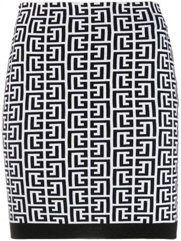 Short white and black knit skirt with Balmain monogram