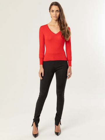 Red V-neck sweater 
long sleeves