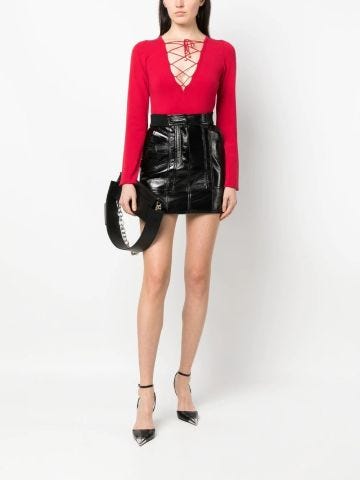 Red long-sleeved sweater with cut-out front with laces