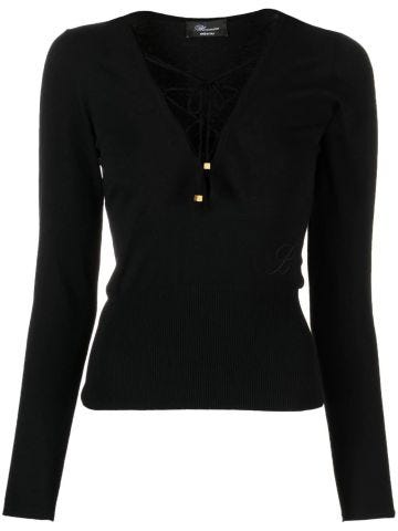Black long-sleeved sweater with cut-out front with ties