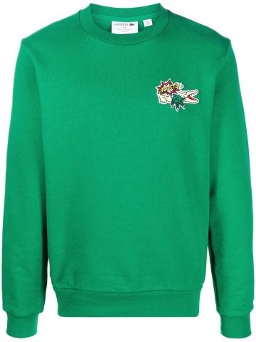 Green crew-neck sweatshirt with appliqué
