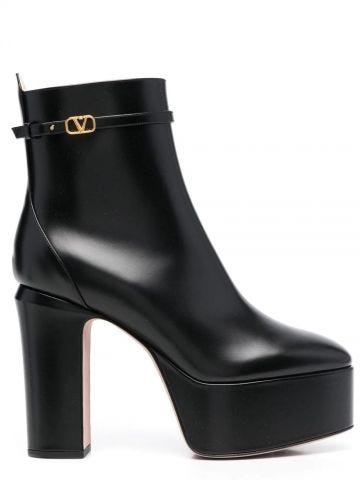 Black ankle boot with platform and logo strap