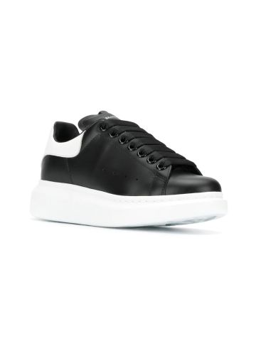 Oversized black trainers with white detailing on the heel