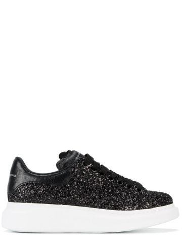 Oversized black glitter sneakers with contrasting leather detailing