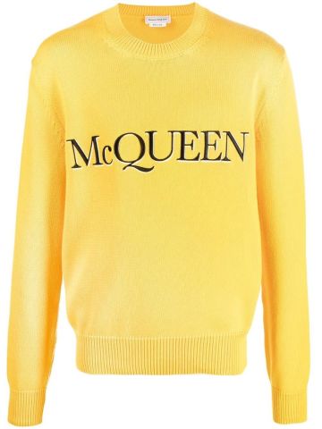 Yellow crewneck sweater with black logo embroidery