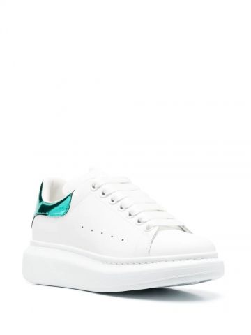 Oversized white trainers with metallic green contrast detail
