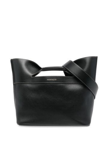 Black handbag with shoulder strap and logo print