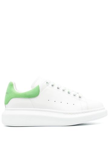 White oversized trainers with green suede detailing