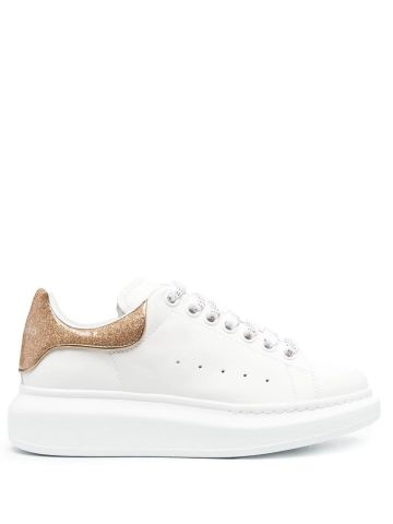 White oversized trainers with gold glitter detailing