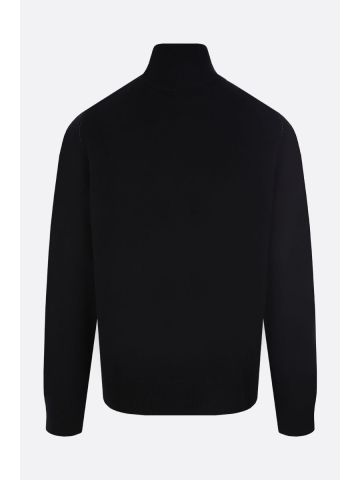 Pullover nero in lana con cuciture a contrasto