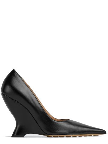 Black wedge pumps with pointed tassel toe