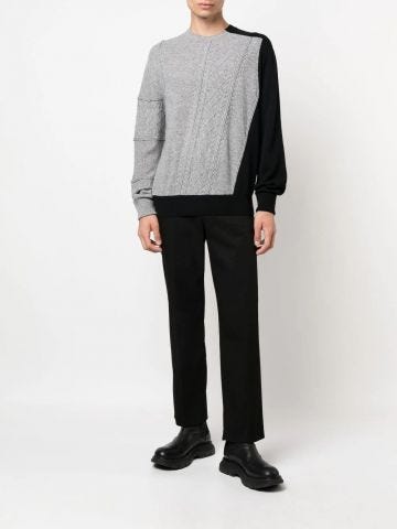 Black and grey two-tone cable-knit jumper