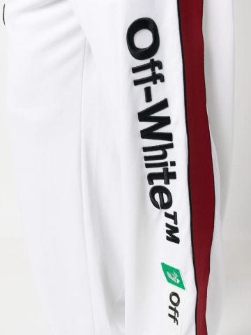Pantaloni bianchi sportivi con logo ricamato