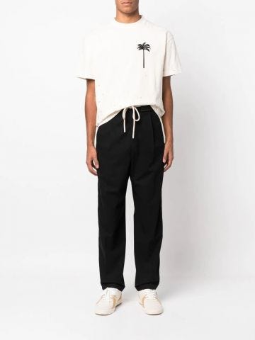 Black sports trousers with white side stripes