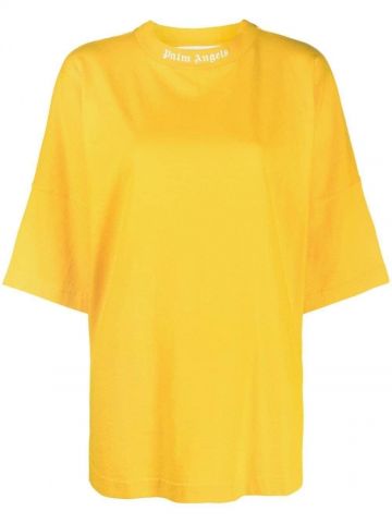 T-shirt gialla con stampa logo