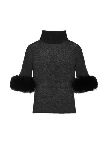 Black semi-sheer turtleneck sweater with fur trim