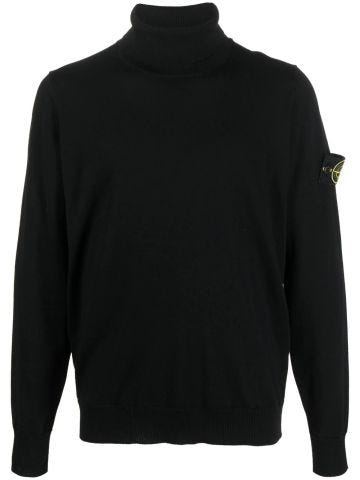 Black rolled turtleneck sweater with compass logo patch
