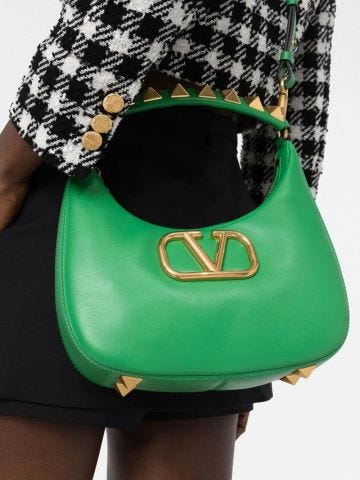 Green shoulder bag with logo and gold metal studs