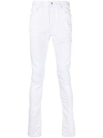 Jeans skinny bianco con placca logo