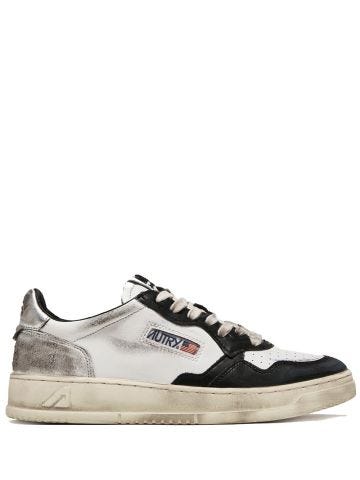Super vintage low sneaker in black white and silver leather