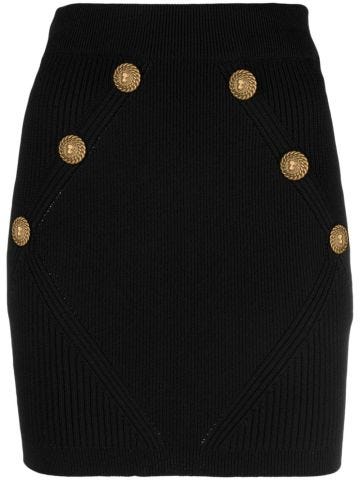 Black miniskirt with gold buttons
