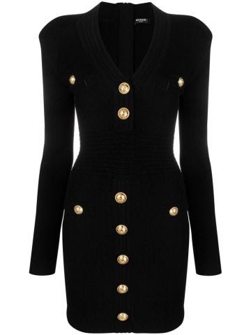 Short black knit dress with V-neck