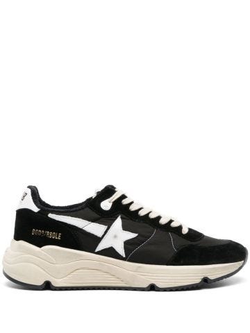 Black trainers with star appliqué