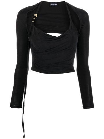 Black draped peplum top with cut-out detail