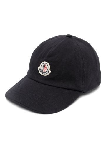 Blue baseball cap with logo appliqué