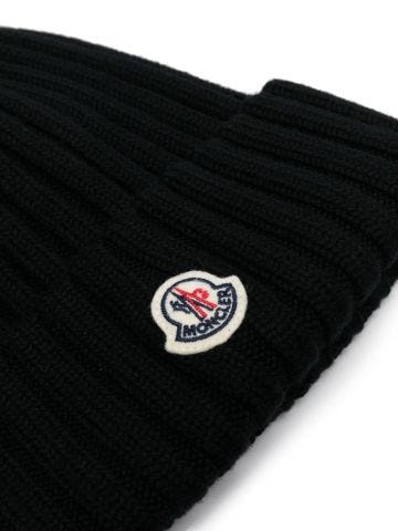 Black ribbed cap with logo and pompom