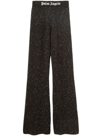 Black glitter print flared trousers
