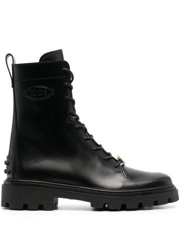 Black boots with logo plaque