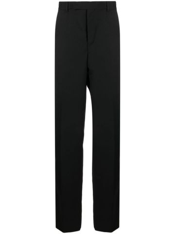 Black tailored trousers with Medusa plaque detail