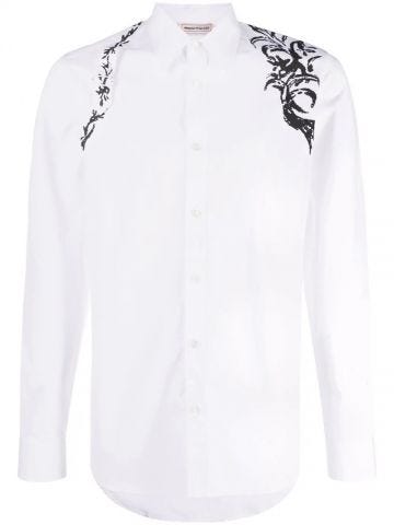 Camicia bianca con stampa a fiori sulle spalle