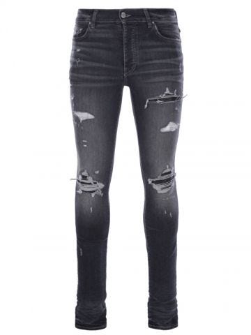 Jeans skinny grigi MX1 con dettagli in pelle