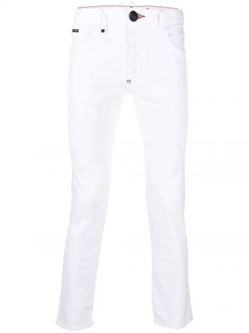 Jeans slim bianchi con ricamo logo