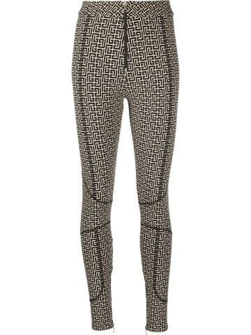 Leggings with all-over logo print and zipper
