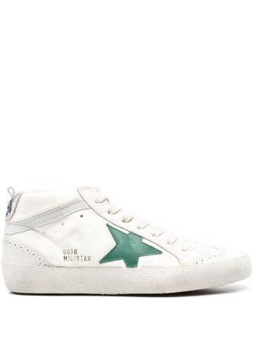 White Superstar lace-up sneakers with green star