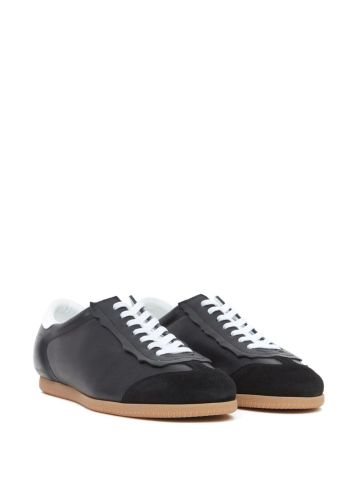 Black trainers with white inserts and suede toe