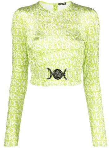 Green long-sleeved crop top with logo print