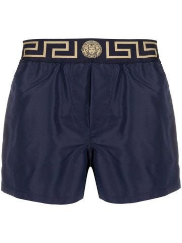 Blue boxer swimsuit with Greek motif band