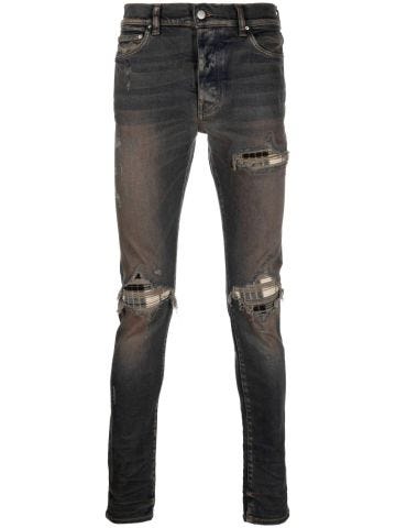 Indigo blue slim jeans with distressed effect