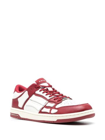 White skel top sneakers with red inserts