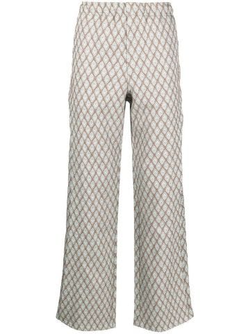 Beige trousers with jacquard pattern and overlays