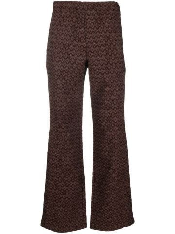 Brown trousers with jacquard pattern and overlays