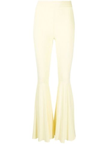 Yellow flared pants in pleated knit