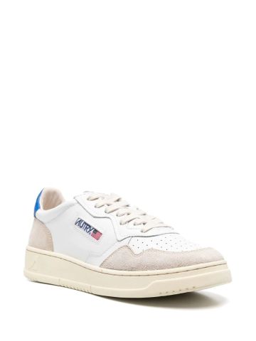 White trainers with contrasting blue heel
