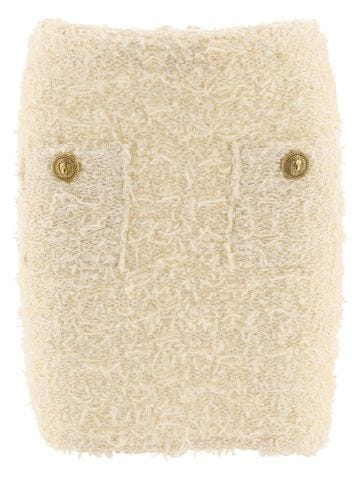 Ivory bouclé miniskirt with gold buttons
